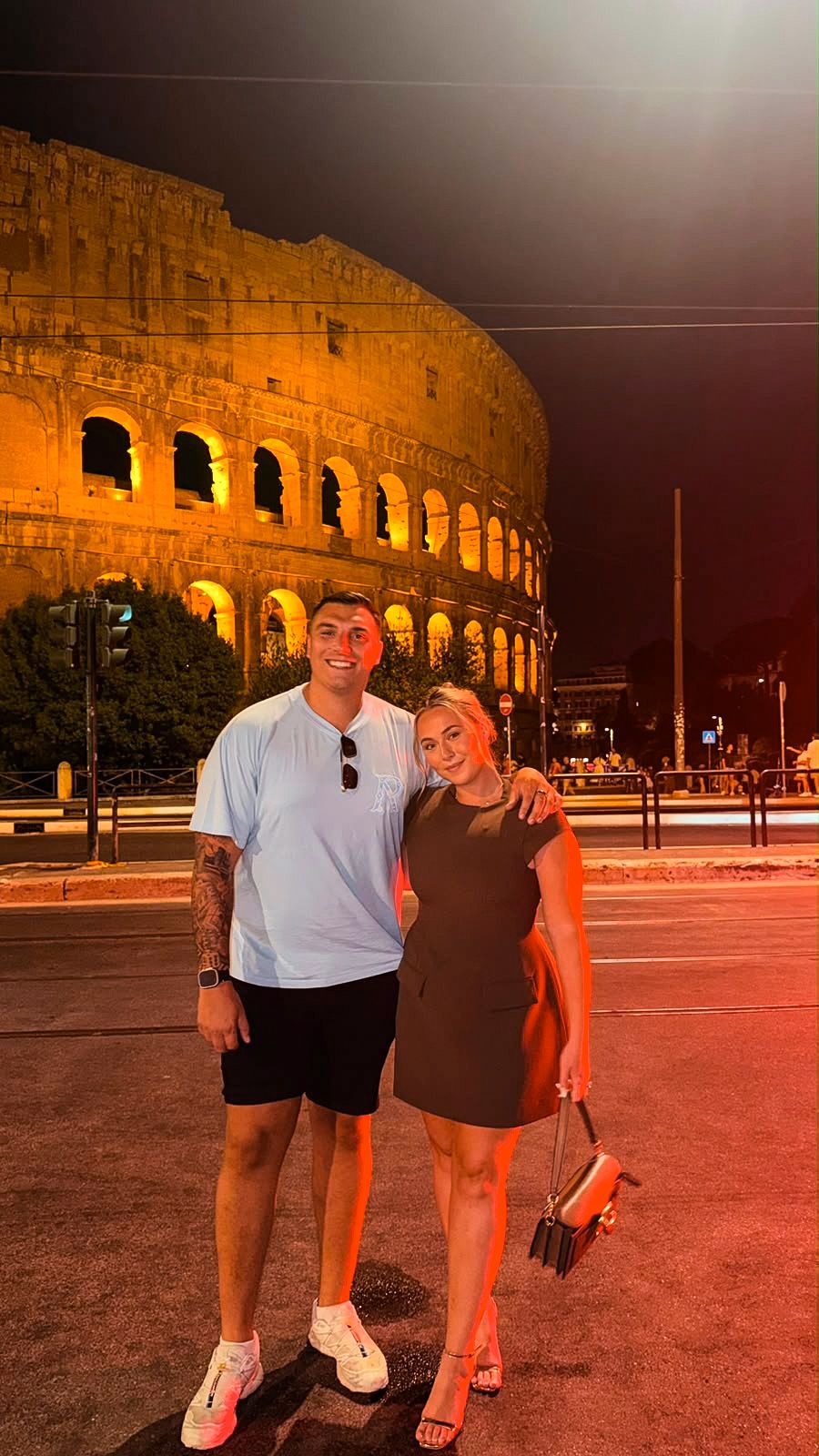 Victoria and Jamie outside the Colosseum in Rome at night