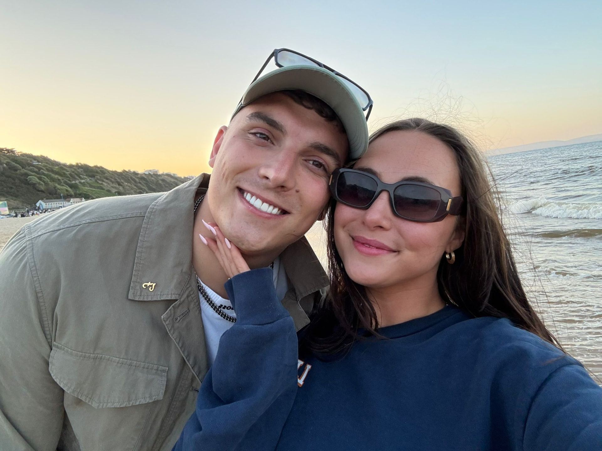 Victoria and Jamie on the beach at golden hour